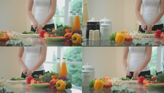 快乐女人烹饪蔬菜绿色沙拉高清在线视频素材下载