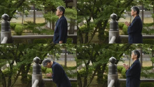 一名日本老人在寺庙里祈祷高清在线视频素材下载