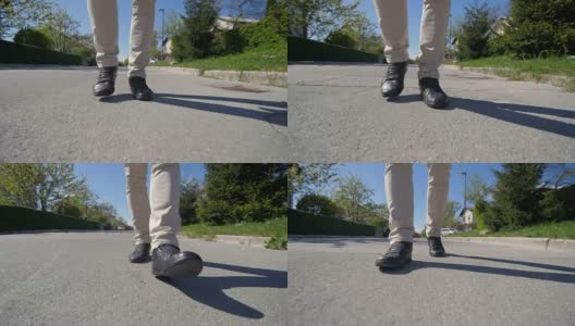 男人的脚正走在阳光灿烂的路上高清在线视频素材下载