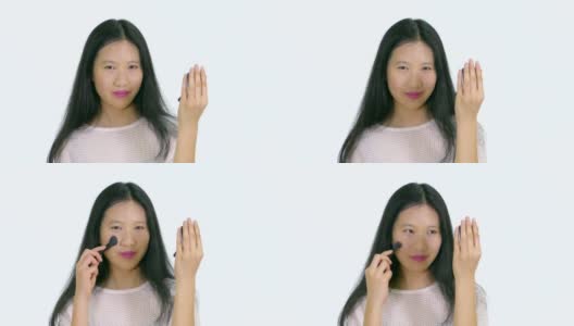 中国青少年用刷子化妆高清在线视频素材下载