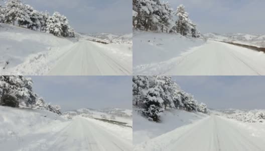 冬天下雪危险，行驶在乡村弯弯曲曲的山路上上山高清在线视频素材下载