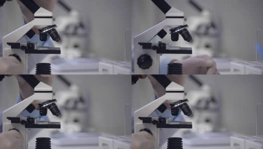 放大了科学家通过显微镜观察的视角高清在线视频素材下载