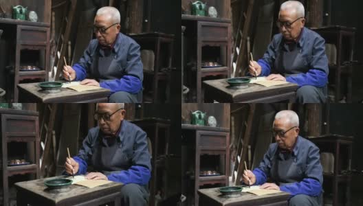 中国老人在写中国书法高清在线视频素材下载