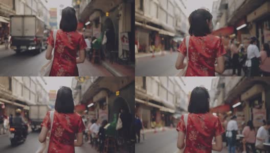 亚洲女性穿旗袍购物。高清在线视频素材下载