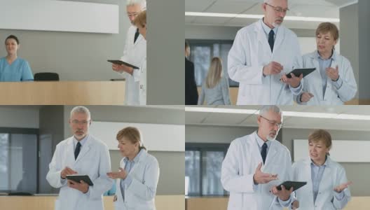 在医院，医生们在大厅边走边用平板电脑讨论。背景:患者与医务人员。新型现代化、功能齐全的医疗设施。高清在线视频素材下载