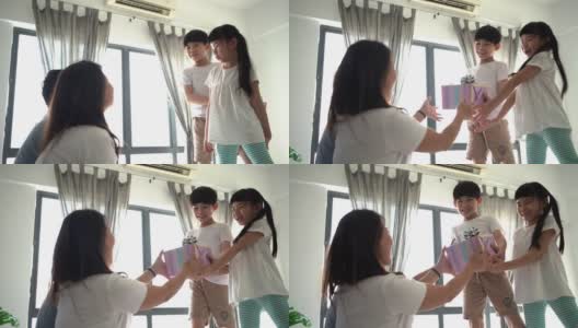 亚洲孩子给妈妈一个惊喜的礼物高清在线视频素材下载