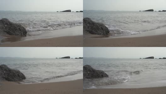 海浪拍打着海边的沙滩高清在线视频素材下载