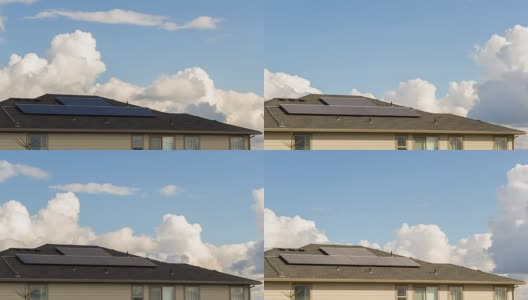 屋顶安装太阳能电池板系统的家庭上空的云的时间间隔为4k高清在线视频素材下载