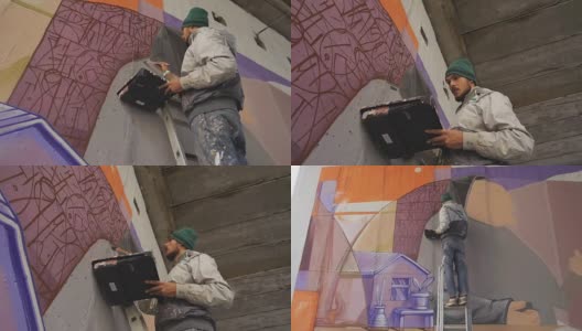 涂鸦艺术家在墙上画的画高清在线视频素材下载