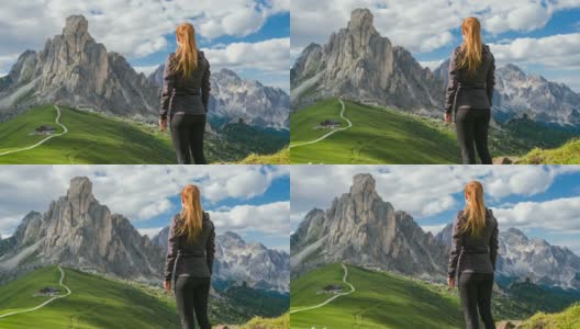 女游客探索意大利山腰，徒步旅行和欣赏风景的焦山口，白云石高清在线视频素材下载