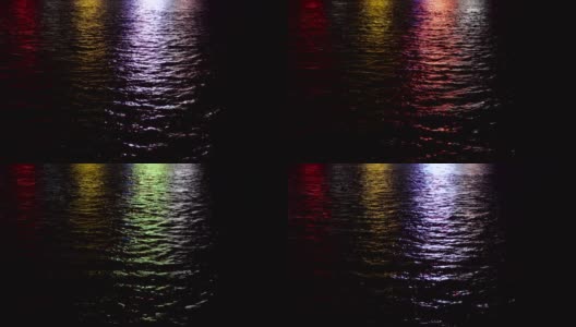 夜晚城市的灯光反射在水面上。高清在线视频素材下载