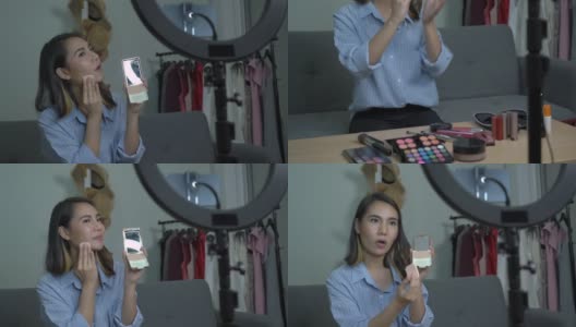一位女博主展示如何将粉饼涂在脸上高清在线视频素材下载