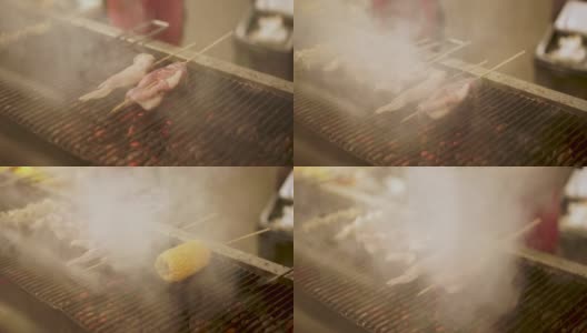 沙嗲肉和鸡肉在热炭上烤高清在线视频素材下载