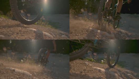近距离镜头:阳光照耀在沙砾小路上，作为下坡自行车骑过相机。高清在线视频素材下载