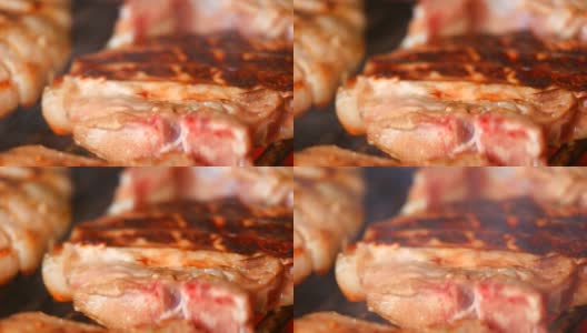 在烤肉上烤新鲜的肉高清在线视频素材下载
