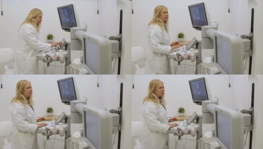 一位女性放射科医生准备了一台现代3d超声波扫描仪进行检查高清在线视频素材下载