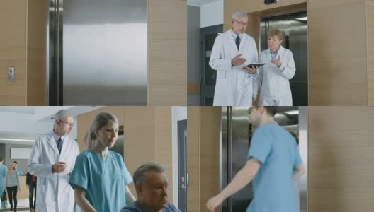 在医院，两位医生走出电梯，一边聊天一边玩平板电脑。背景:患者与医务人员。新型现代化、功能齐全的医疗设施。高清在线视频素材下载