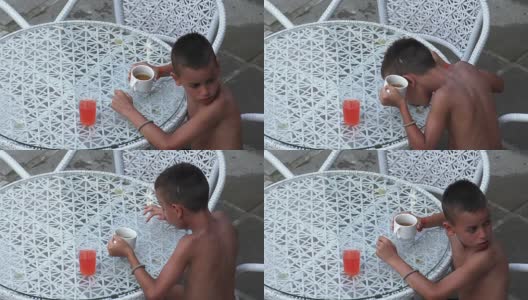 纳克特小男孩爱打喷嚏的饮料，夏天禁止在游泳池边的桌子上喝柠檬水饮料高清在线视频素材下载