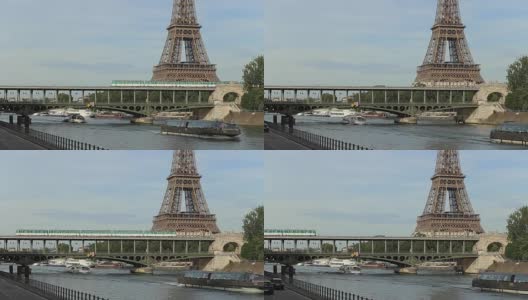 法国巴黎，靠近埃菲尔铁塔的塞纳河大桥上的地铁列车。铁路交通网连接城市各区。大城市的城市交通与人口运输高清在线视频素材下载