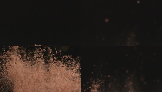 棕色面粉在黑色背景下跳动高清在线视频素材下载