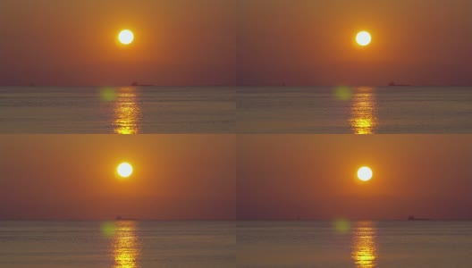 平静的海面上金色的夕阳高清在线视频素材下载