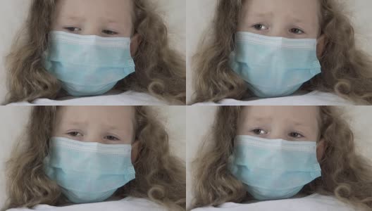 重病女孩子戴着医用口罩，惊恐地看着注射器高清在线视频素材下载