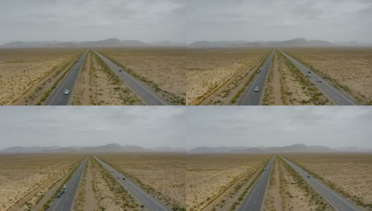 汽车在戈壁沙漠上行驶的鸟瞰图高清在线视频素材下载