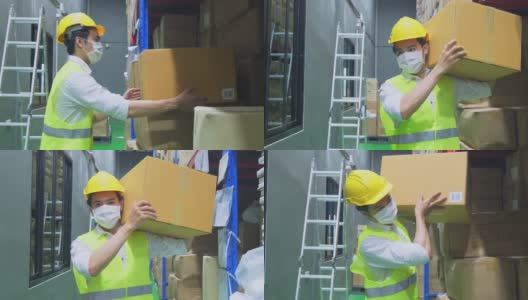 新冠肺炎流行期间，亚洲男性工人戴口罩工作。年轻人带着安全帽、背心搬运产品箱放到物流和出口工厂的货架上。高清在线视频素材下载