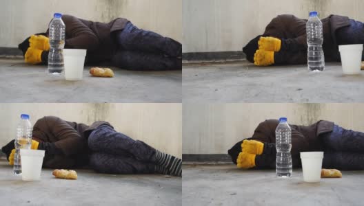 无家可归者睡在人行道上高清在线视频素材下载