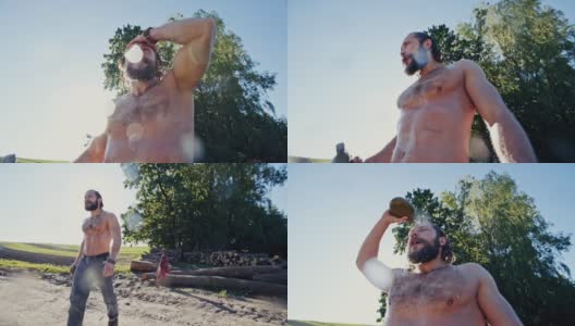 在炎热的夏天，蓄着胡须的男子一边喝水，一边倒瓶子里的水——慢动作高清在线视频素材下载