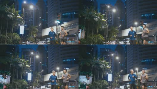亚洲华人活跃的老人和儿子晚上下班后一起在城里跑步慢跑高清在线视频素材下载