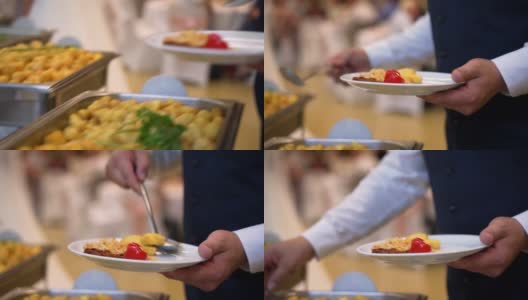 自助餐，客人把食物放在盘子里高清在线视频素材下载