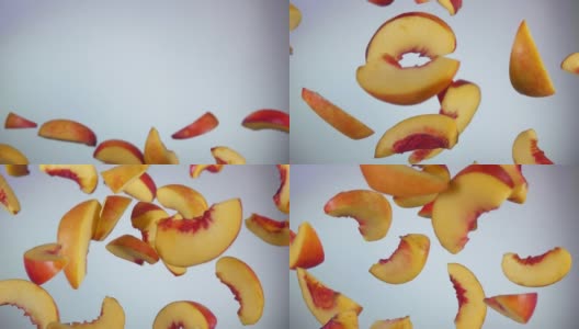 桃子片在白色背景上跳跃的特写高清在线视频素材下载