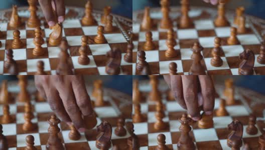 国际象棋的特写镜头，一个印度人的手在背景移动国际象棋的棋子。国际象棋的背景。成功商人的概念，战略思维。高清在线视频素材下载