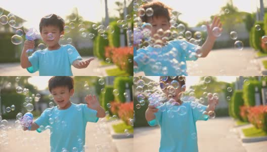 亚洲小孩在公园玩泡泡。幸福和夏日的概念高清在线视频素材下载