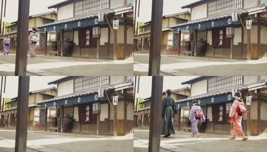 江户时代的日本村落中穿着传统服饰的多代家庭高清在线视频素材下载