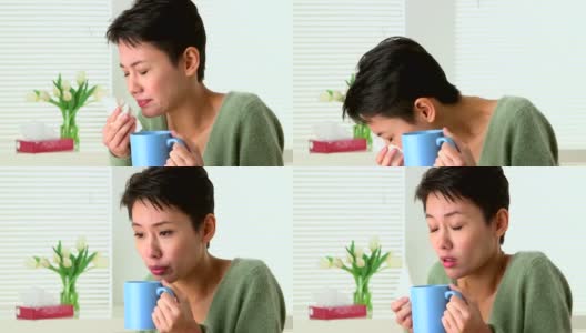 中国妇女因感冒打喷嚏和喝茶而生病高清在线视频素材下载