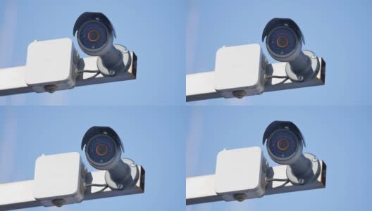 安防摄像头和城市视频监控，防盗防贼，抵御户外的蓝天高清在线视频素材下载