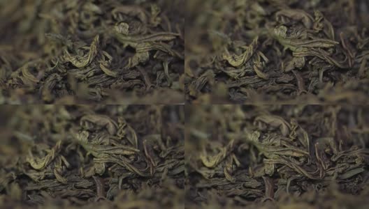茶药材质地。绿茶。有机干绿茶叶。一堆干绿茶的背景。宏高清在线视频素材下载