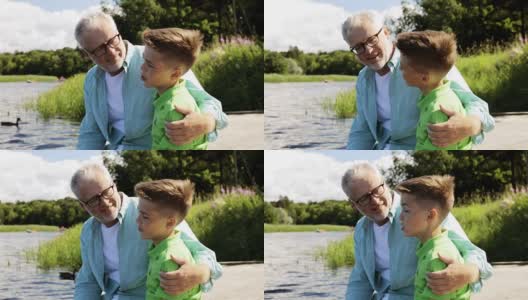 爷爷和孙子坐在码头上聊天高清在线视频素材下载
