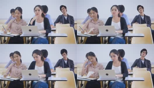一群亚洲学生正在课堂上学习，学习和教育理念高清在线视频素材下载