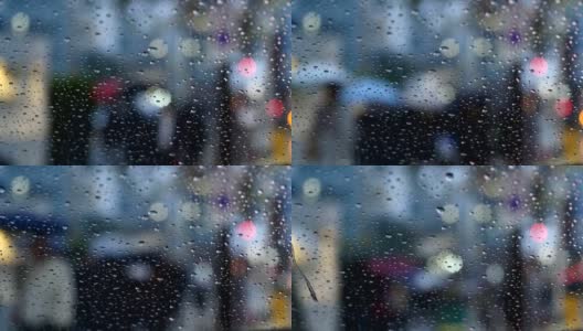 在一个下雨的下午，东京商业区的偏离焦点的通勤者的变化。高清在线视频素材下载