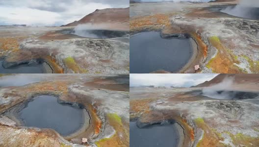 冰岛间歇泉喷发。红色的土壤，就像火星表面一样高清在线视频素材下载