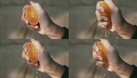 手捏橘子，慢动作高清在线视频素材下载