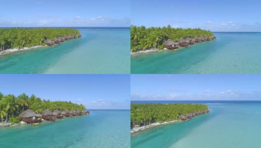 无人机:郁郁葱葱的热带岛屿和豪华海滨平房的壮观镜头。高清在线视频素材下载