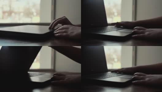 一个女人的手打开了一个笔记本电脑的盖子在窗口附近的特写慢动作高清在线视频素材下载