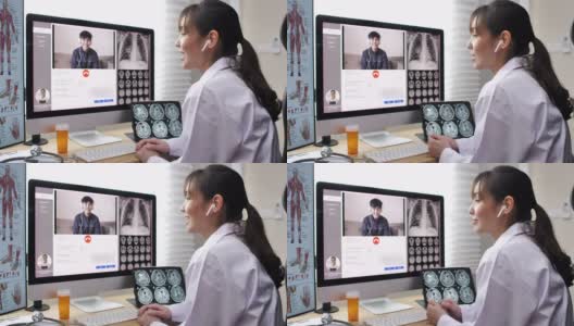 对病人进行远程医疗咨询的亚洲医生高清在线视频素材下载