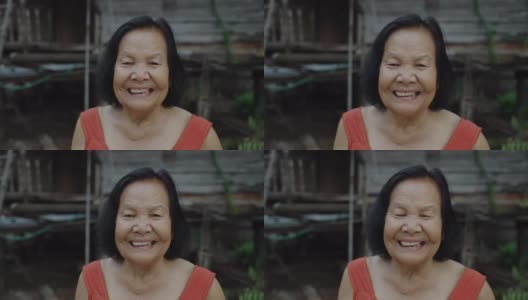 泰国老妇人在圆领无袖领子在老木头的家笑高清在线视频素材下载