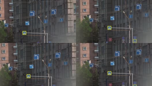 大楼背景上的路标。交通标志高清在线视频素材下载