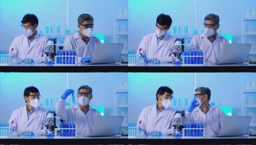 一群亚洲科学家在实验室里做一些研究。高清在线视频素材下载